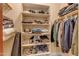 The closet is organized with shelving and hanging rods, maximizing storage space at 2998 E Waterman Way, Gilbert, AZ 85297