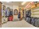 Large walk-in closet offering ample storage with custom shelving and hanging spaces at 2998 E Waterman Way, Gilbert, AZ 85297