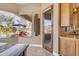A view of the outdoor pool from the dining area, accessed by a glass door at 2998 E Waterman Way, Gilbert, AZ 85297