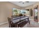 Casual dining area with bench seating and outdoor pool view through a large picture window at 2998 E Waterman Way, Gilbert, AZ 85297