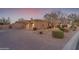 Circular driveway leading to a three-car garage, surrounded by manicured landscaping at 2998 E Waterman Way, Gilbert, AZ 85297