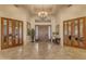 Grand foyer featuring tile floors, decorative lighting, and double doors leading to rooms at 2998 E Waterman Way, Gilbert, AZ 85297