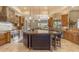 Bright kitchen boasts an island, granite countertops, stainless appliances, and custom cabinets at 2998 E Waterman Way, Gilbert, AZ 85297