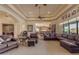Spacious living room with tile and carpet flooring, and large windows at 2998 E Waterman Way, Gilbert, AZ 85297