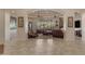 Open-concept living area with comfortable seating, a fireplace, and large windows overlooking the yard at 2998 E Waterman Way, Gilbert, AZ 85297
