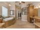 Bright main bathroom features a large soaking tub and glass enclosed shower at 2998 E Waterman Way, Gilbert, AZ 85297