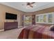Inviting main bedroom featuring recessed ceiling and exterior access to a luxury swimming pool at 2998 E Waterman Way, Gilbert, AZ 85297