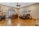 Large home office with hardwood floors, a leather sofa, and an executive desk at 2998 E Waterman Way, Gilbert, AZ 85297