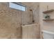 The updated shower features glass doors, sleek hardware, and decorative tile accents at 2998 E Waterman Way, Gilbert, AZ 85297