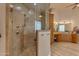Spacious shower with glass enclosure, dual shower heads, and tiled walls in a luxurious bathroom at 2998 E Waterman Way, Gilbert, AZ 85297