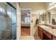 Well lit bathroom featuring a glass enclosed shower and granite countertop vanity at 316 W Kelton Ln, Phoenix, AZ 85023