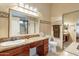 Bathroom with tan tile, vanity with granite countertop, and sliding door shower at 316 W Kelton Ln, Phoenix, AZ 85023