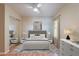 This bedroom features a plush rug and a ceiling fan, offering comfort and style at 316 W Kelton Ln, Phoenix, AZ 85023