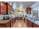 Bright, updated kitchen featuring stainless steel appliances, granite countertops, and wood cabinets at 316 W Kelton Ln, Phoenix, AZ 85023