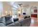Spacious living room with a vaulted ceiling, wood floors, and a ceiling fan at 316 W Kelton Ln, Phoenix, AZ 85023