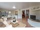 Open-concept living room boasting a vaulted ceiling, wood floors, archway, and home office at 316 W Kelton Ln, Phoenix, AZ 85023