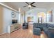 Open-concept living room boasting a vaulted ceiling, wood floors, and archway at 316 W Kelton Ln, Phoenix, AZ 85023