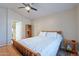 Cozy main bedroom with neutral tones, ceiling fan, and an en-suite bathroom at 316 W Kelton Ln, Phoenix, AZ 85023