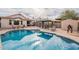 Inviting backyard pool with covered seating area, shed, and meticulously maintained surroundings at 316 W Kelton Ln, Phoenix, AZ 85023