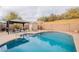 Sparkling pool in a private backyard with a gazebo, shed, and mature landscaping at 316 W Kelton Ln, Phoenix, AZ 85023