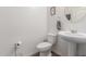 Half bathroom featuring a pedestal sink and modern fixtures at 37295 W Cannataro Ln, Maricopa, AZ 85138