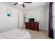 Bedroom with plush carpet, bright walls, and a large dresser at 37295 W Cannataro Ln, Maricopa, AZ 85138