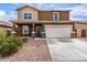 Two-story home featuring a two-car garage and a mix of stucco and siding exterior at 37295 W Cannataro Ln, Maricopa, AZ 85138