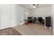 Home office with functional desk setup and neutral carpeting at 37295 W Cannataro Ln, Maricopa, AZ 85138