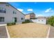 Backyard features a shed, small grassy area, rocks and block fence at 40975 N Arbor Ave, San Tan Valley, AZ 85140