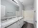 Bright bathroom featuring double sinks, granite counters and a shower/tub combo at 40975 N Arbor Ave, San Tan Valley, AZ 85140