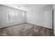 Bright bedroom with neutral walls, shuttered windows and plush carpeting at 40975 N Arbor Ave, San Tan Valley, AZ 85140