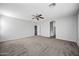Spacious bedroom featuring plush carpeting, neutral walls and a ceiling fan at 40975 N Arbor Ave, San Tan Valley, AZ 85140