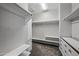 Organized walk-in closet featuring shelving, drawers, and ample storage space at 40975 N Arbor Ave, San Tan Valley, AZ 85140