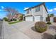 Two-story home featuring a three-car garage and well-manicured landscaping at 40975 N Arbor Ave, San Tan Valley, AZ 85140