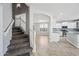 Inviting interior showcases the staircase, kitchen, and living room with neutral tones and lots of natural light at 40975 N Arbor Ave, San Tan Valley, AZ 85140