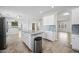 Bright, open kitchen with island, granite countertops, stainless steel appliances, and ample cabinet space at 40975 N Arbor Ave, San Tan Valley, AZ 85140