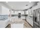 Well-lit kitchen featuring granite counters, stainless steel appliances, and ample cabinet space at 40975 N Arbor Ave, San Tan Valley, AZ 85140