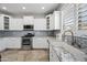 Well-equipped kitchen featuring granite countertops, stainless steel appliances, and stylish cabinetry at 40975 N Arbor Ave, San Tan Valley, AZ 85140