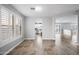 Open floor plan with tile floor, shutters, and an archway to the kitchen at 40975 N Arbor Ave, San Tan Valley, AZ 85140
