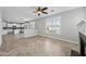Open-concept living room and kitchen with tile flooring and a ceiling fan at 40975 N Arbor Ave, San Tan Valley, AZ 85140