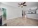 Open-concept living space showcasing tile flooring, and a glimpse into the modern kitchen at 40975 N Arbor Ave, San Tan Valley, AZ 85140