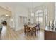 Bright dining room featuring white walls, plantation shutters, and modern light fixture at 4147 W Victoria Ln, Chandler, AZ 85226