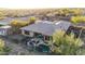 Captivating aerial view of a home showcasing a well-designed outdoor living space, pool, and meticulously maintained landscaping at 42019 N Golf Crest Rd, Anthem, AZ 85086