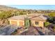 Expansive desert views surround this beautiful home, featuring a large three-car garage at 42019 N Golf Crest Rd, Anthem, AZ 85086