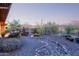 Expansive backyard featuring desert landscaping, privacy fence, and mountain views at 42019 N Golf Crest Rd, Anthem, AZ 85086