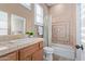 Bathroom with decorative tiles, shower with curtain, and tile countertop at 42019 N Golf Crest Rd, Anthem, AZ 85086