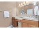 Bathroom featuring tiled countertop, cabinets and a large mirror at 42019 N Golf Crest Rd, Anthem, AZ 85086