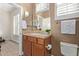Bathroom featuring a sink, vanity with cabinets, and tiled countertop at 42019 N Golf Crest Rd, Anthem, AZ 85086