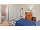 Bedroom with hardwood floors, closet, and access to bathroom at 42019 N Golf Crest Rd, Anthem, AZ 85086