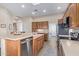 Bright, open concept kitchen featuring stainless steel appliances and a light-colored countertop at 42019 N Golf Crest Rd, Anthem, AZ 85086